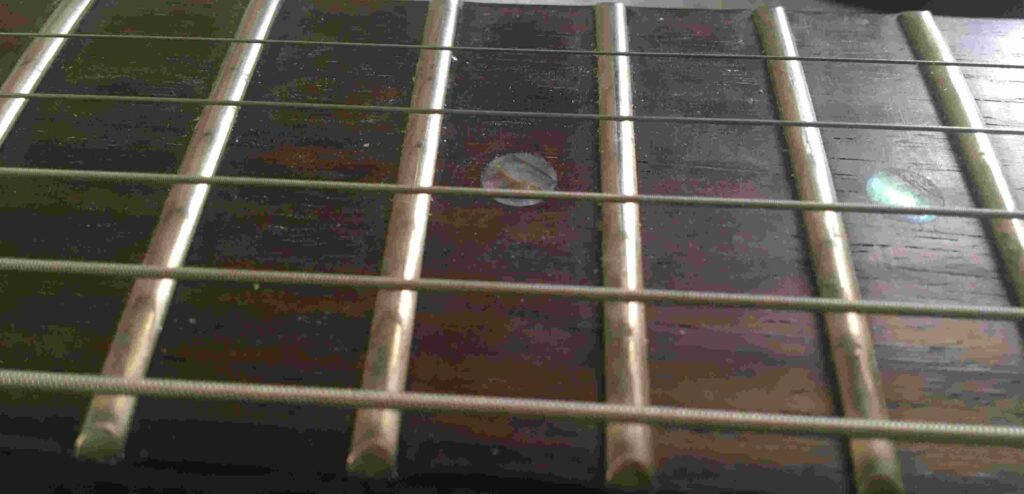 electric guitar fretboard action