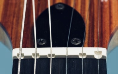 a compensated guitar nut on an electric guitar