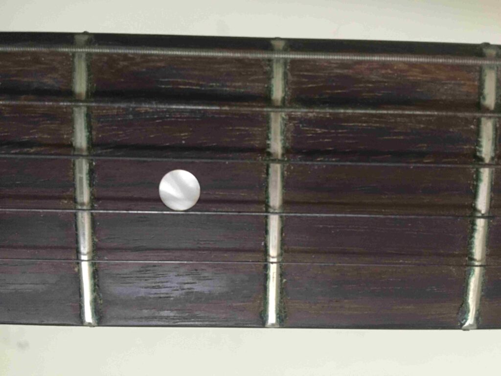 old used guitar strings fretboard