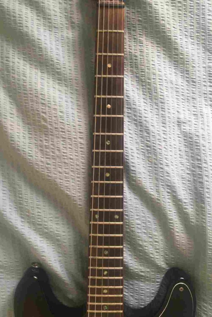 part of a guitar neck
