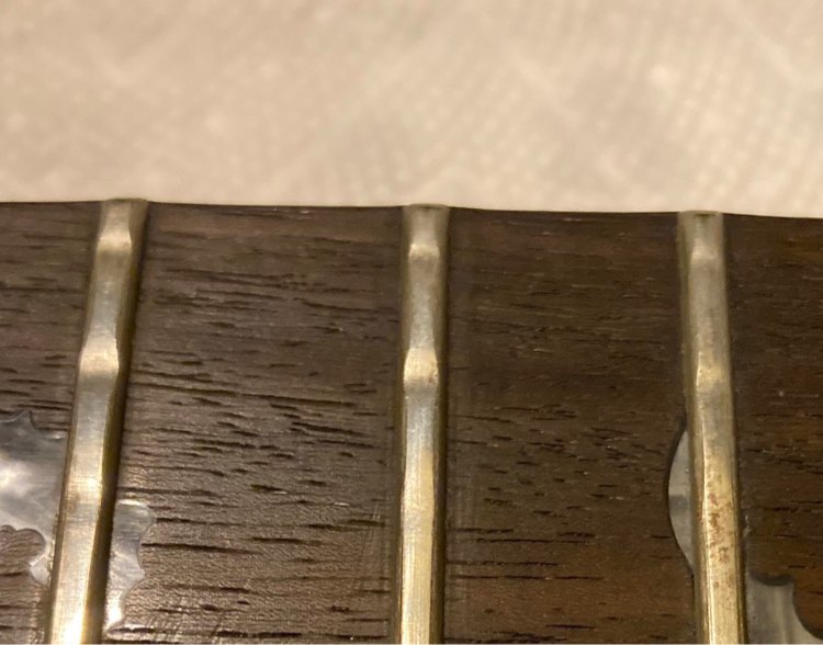 worn frets with divots