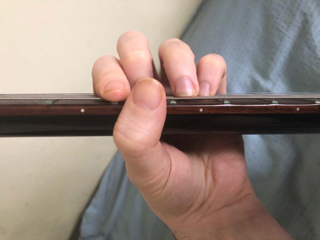 thumb over neck barre chord wrong position